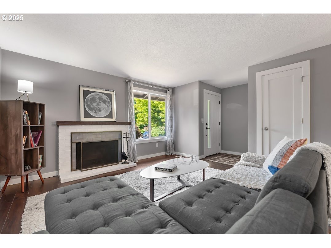 11595 Southwest Fairview Lane Tigard, OR 97223 - Photo 6 of 46 a living room with furniture a window and a fireplace