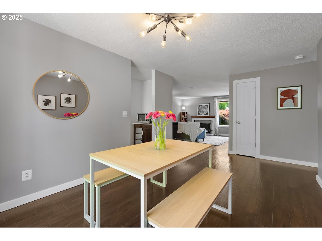 11595 Southwest Fairview Lane Tigard, OR 97223 - Photo 10 of 46 a view of a kitchen with a dining table and chairs