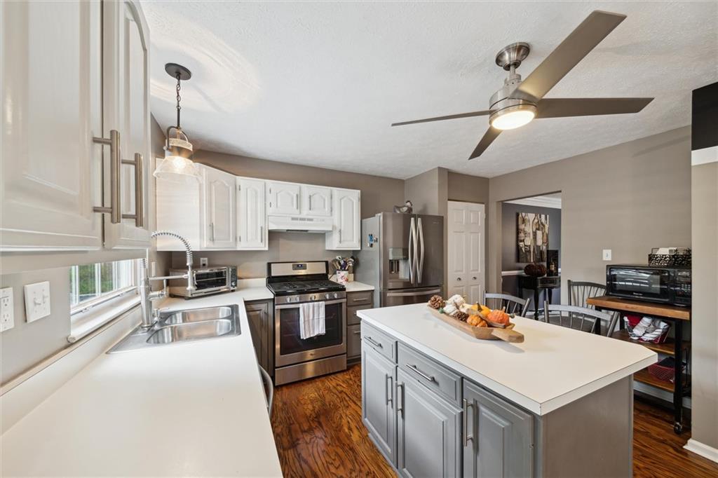 313 Timberlake Drive Venetia, PA 15367 - Photo 12 of 49 a kitchen with a stove a sink and a refrigerator