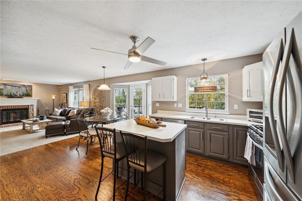 313 Timberlake Drive Venetia, PA 15367 - Photo 14 of 49 a kitchen with a table chairs stove and cabinets