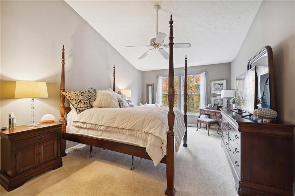 313 Timberlake Drive Venetia, PA 15367 - Photo 22 of 49 a spacious bedroom with a bed a couch and dresser