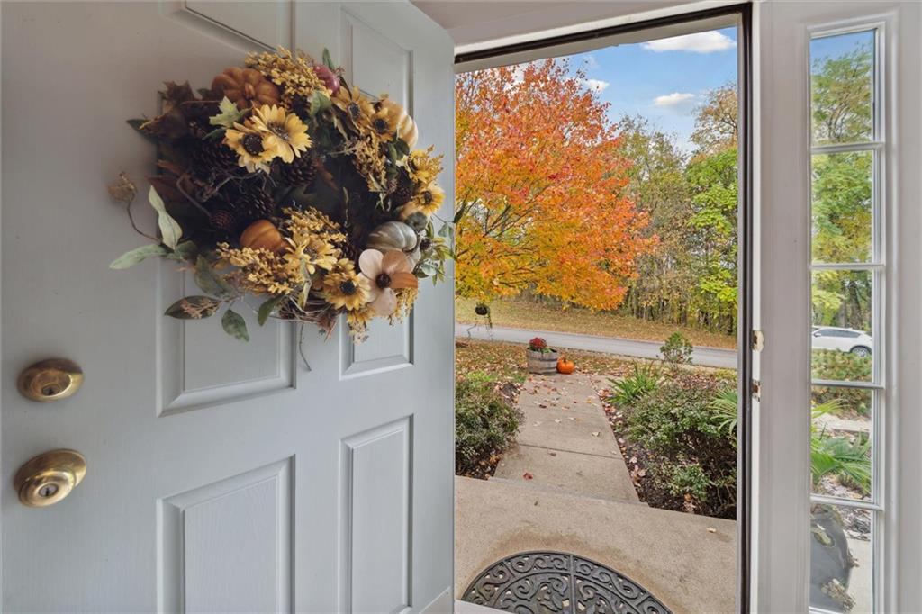 313 Timberlake Drive Venetia, PA 15367 - Photo 6 of 49 a vase of flowers sitting on a table with a large window