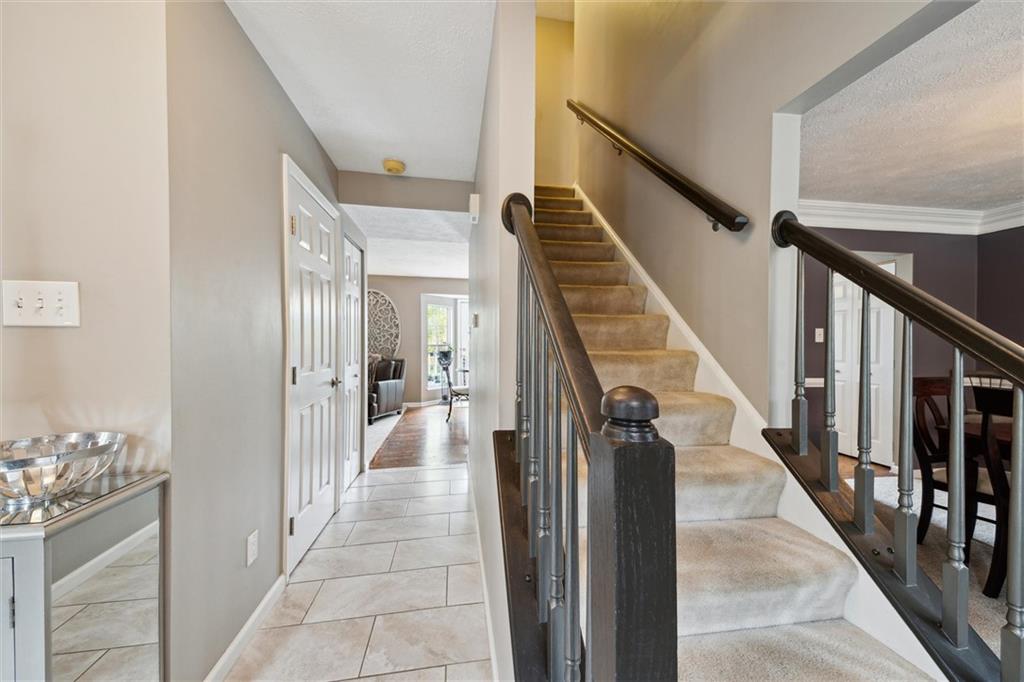 313 Timberlake Drive Venetia, PA 15367 - Photo 7 of 49 a view of a hallway with wooden floor and staircase