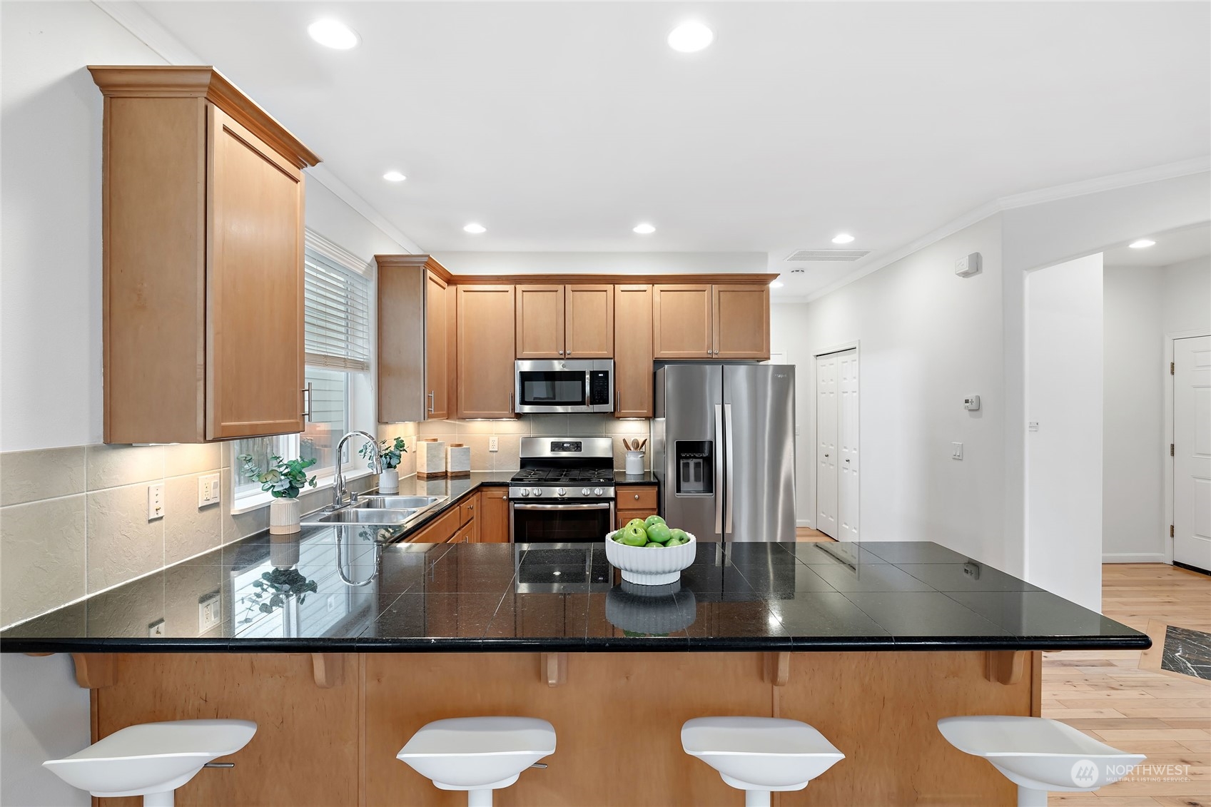 1700 235th Place Southwest Bothell, WA 98021 - Photo 11 of 36 a view of kitchen with stainless steel appliances granite countertop a sink refrigerator and microwave