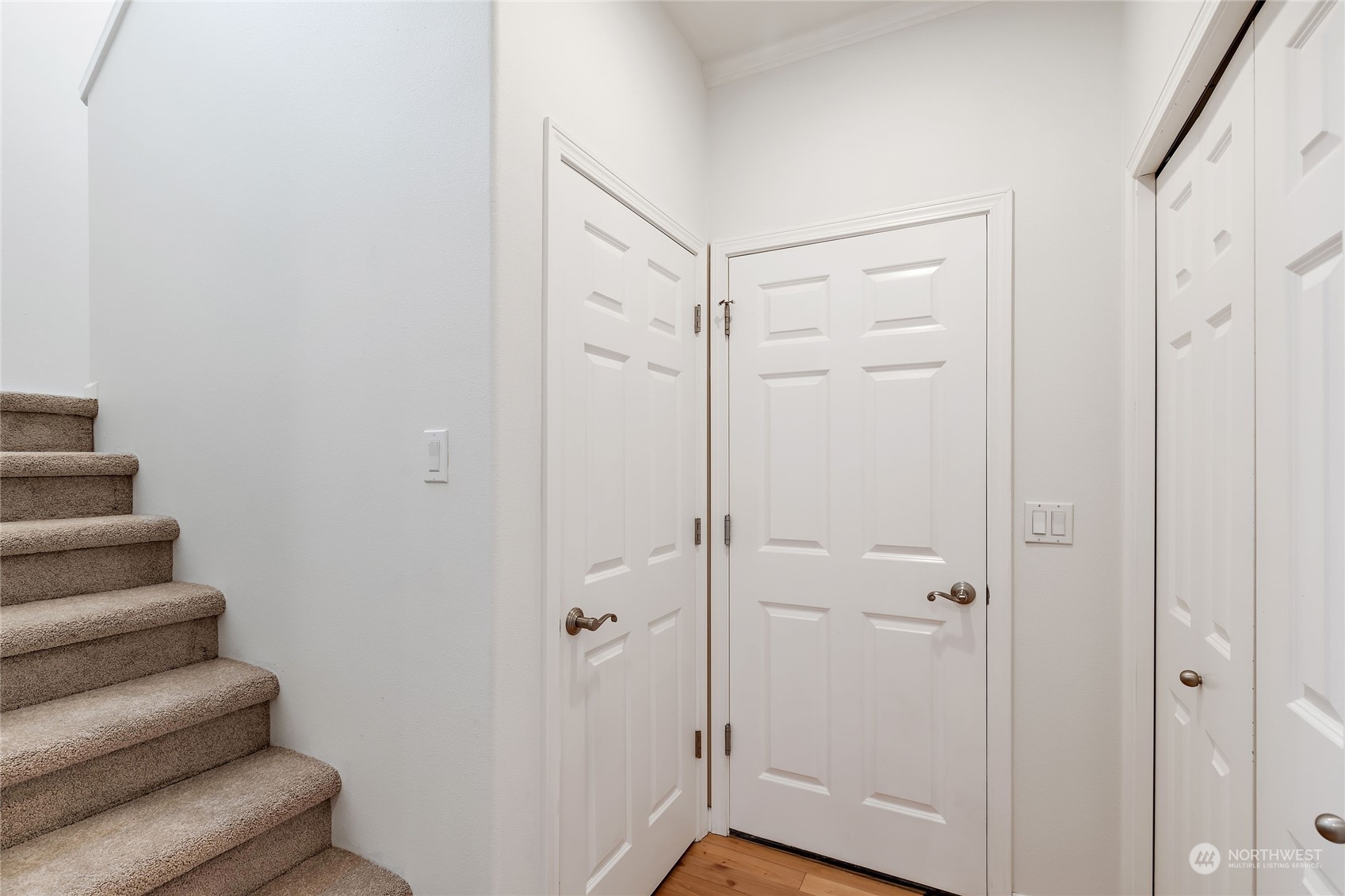 1700 235th Place Southwest Bothell, WA 98021 - Photo 16 of 36 a view of a hallway with wooden floor and closet