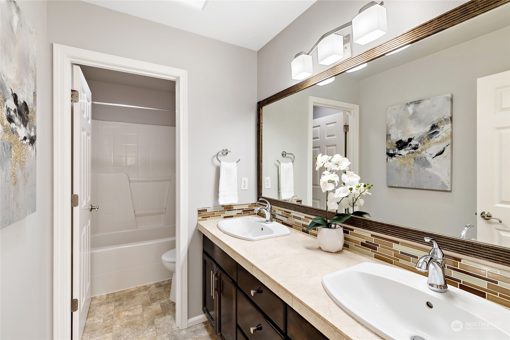 1700 235th Place Southwest Bothell, WA 98021 - Photo 21 of 36 a bathroom with a sink a toilet and shower