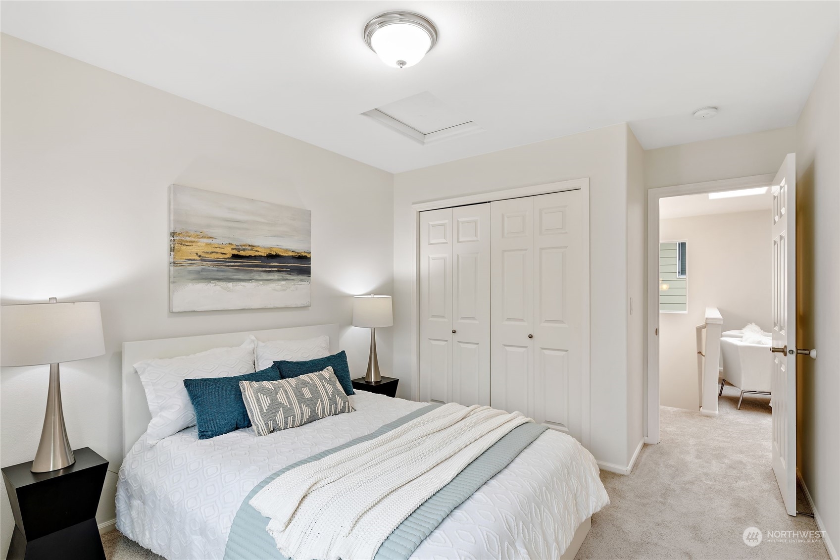 1700 235th Place Southwest Bothell, WA 98021 - Photo 23 of 36 a bedroom with a bed and a lamp