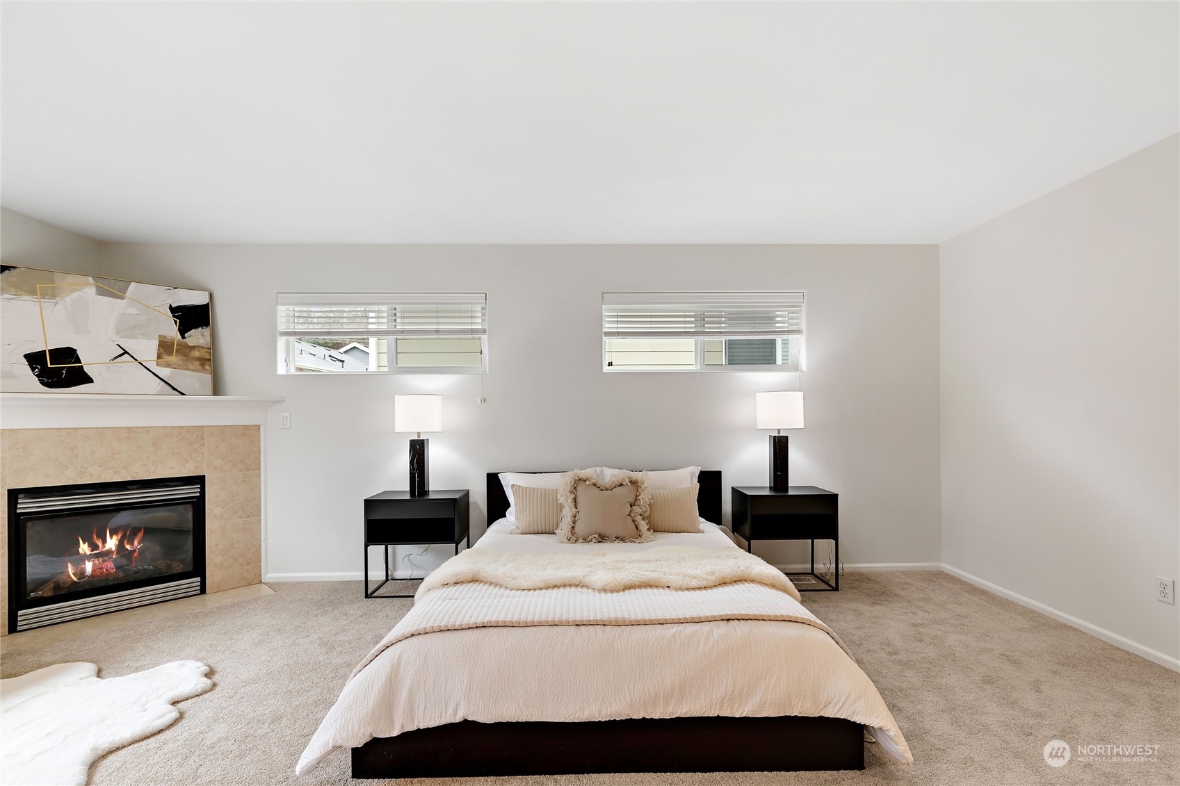 1700 235th Place Southwest Bothell, WA 98021 - Photo 29 of 36 a bedroom with a bed and a fireplace