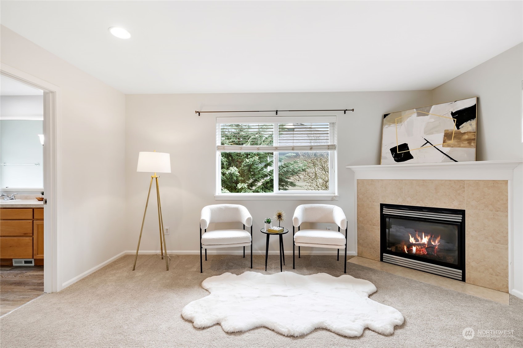 1700 235th Place Southwest Bothell, WA 98021 - Photo 30 of 36 a living room with furniture a window and a fireplace