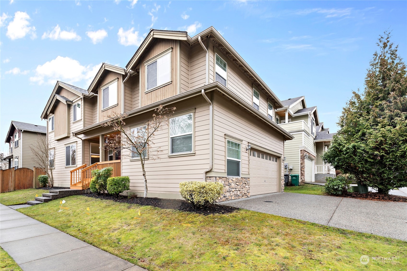 1700 235th Place Southwest Bothell, WA 98021 - Photo 3 of 36 a front view of a house with a yard