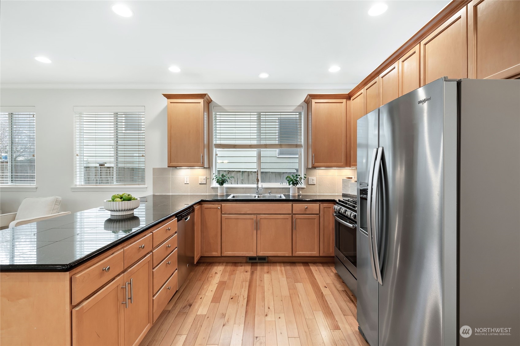 1700 235th Place Southwest Bothell, WA 98021 - Photo 10 of 36 a kitchen with stainless steel appliances granite countertop a refrigerator and a sink