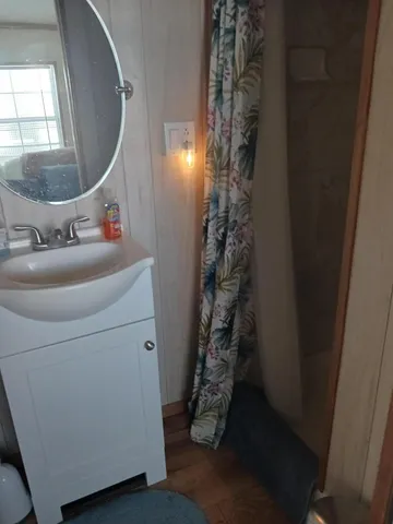 a room with pool table and windows