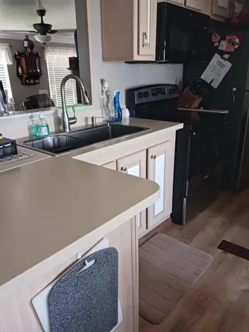 a kitchen with a stove and a refrigerator