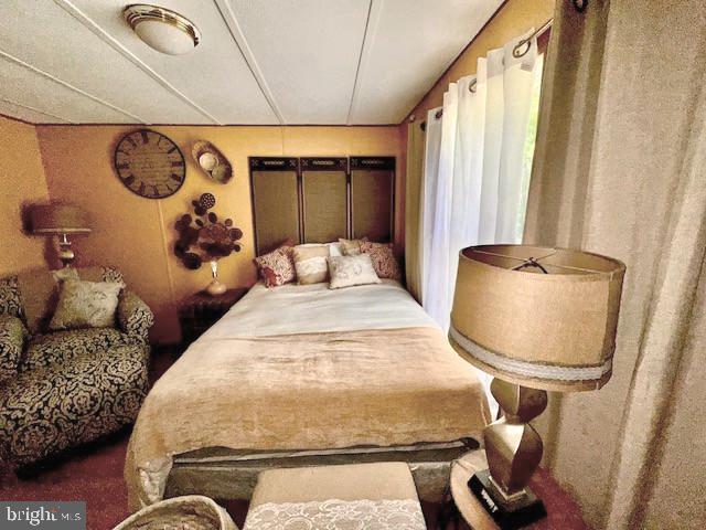 4770 Daughertytown Road, Unit B Crisfield, MD 21817 - Photo 6 of 9 a bedroom with bed and window