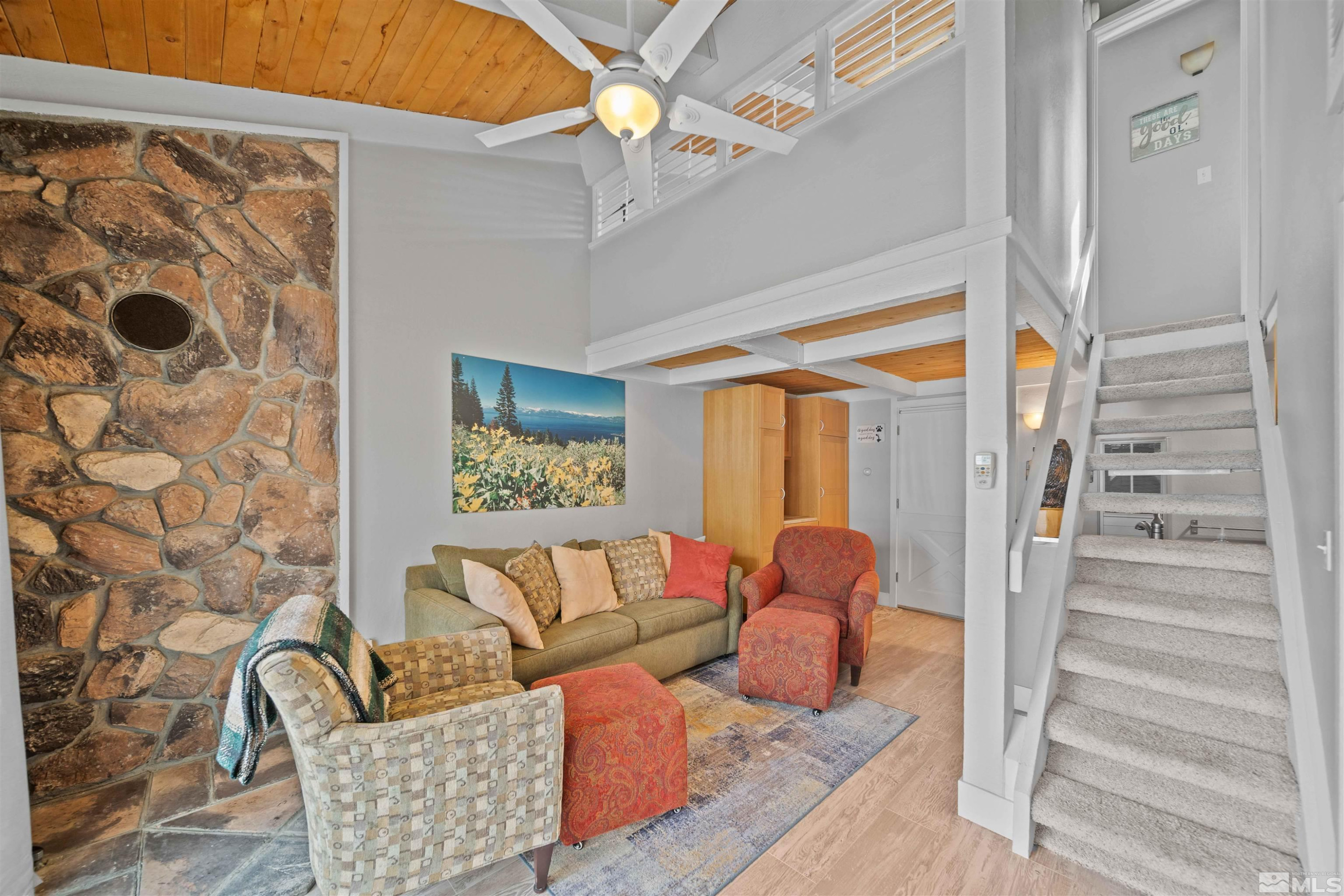 331 Tramway Drive, Unit 26 Stateline, NV 89449 - Photo 11 of 27 a living room with furniture and a window