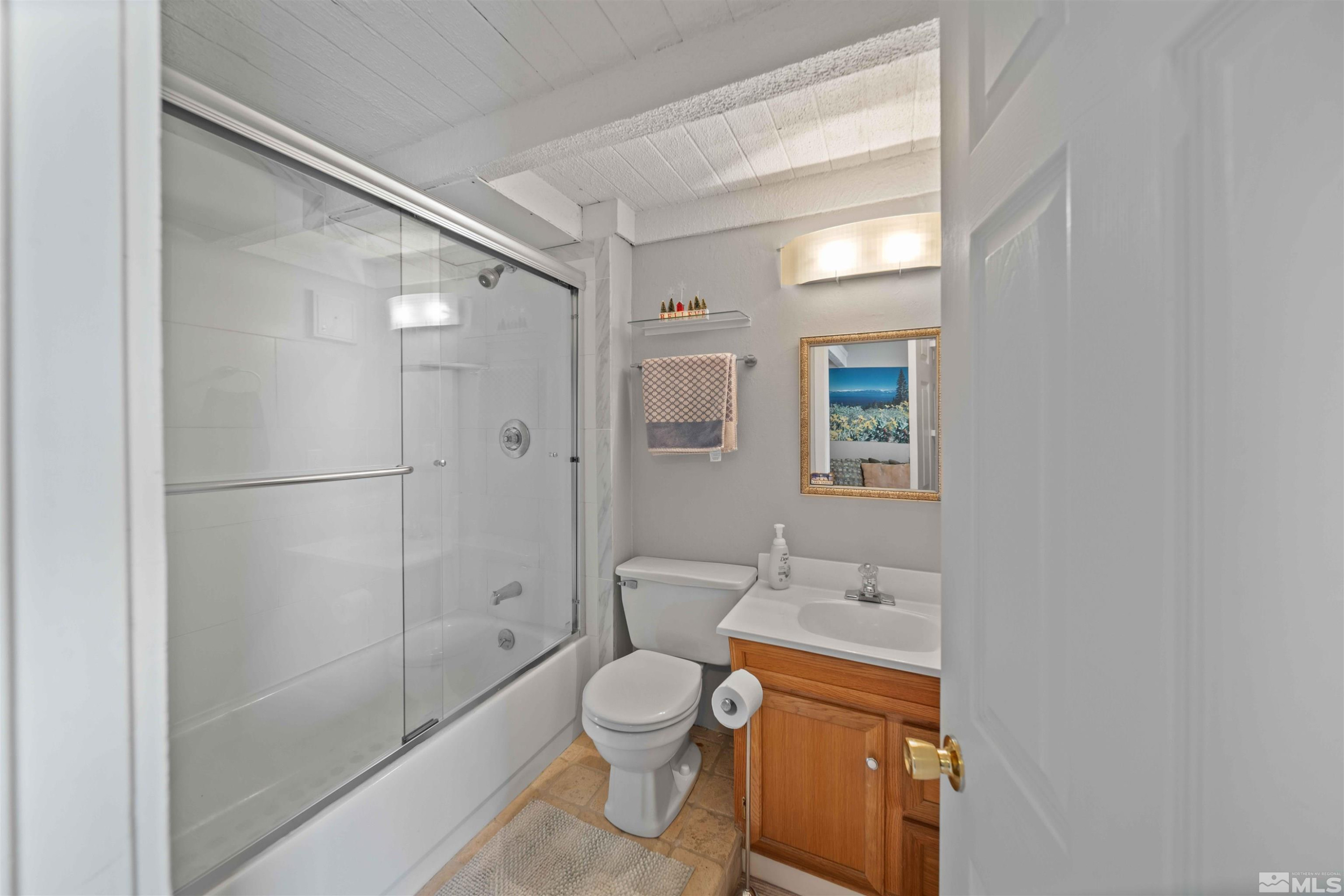 331 Tramway Drive, Unit 26 Stateline, NV 89449 - Photo 16 of 27 a bathroom with a toilet a shower and a sink