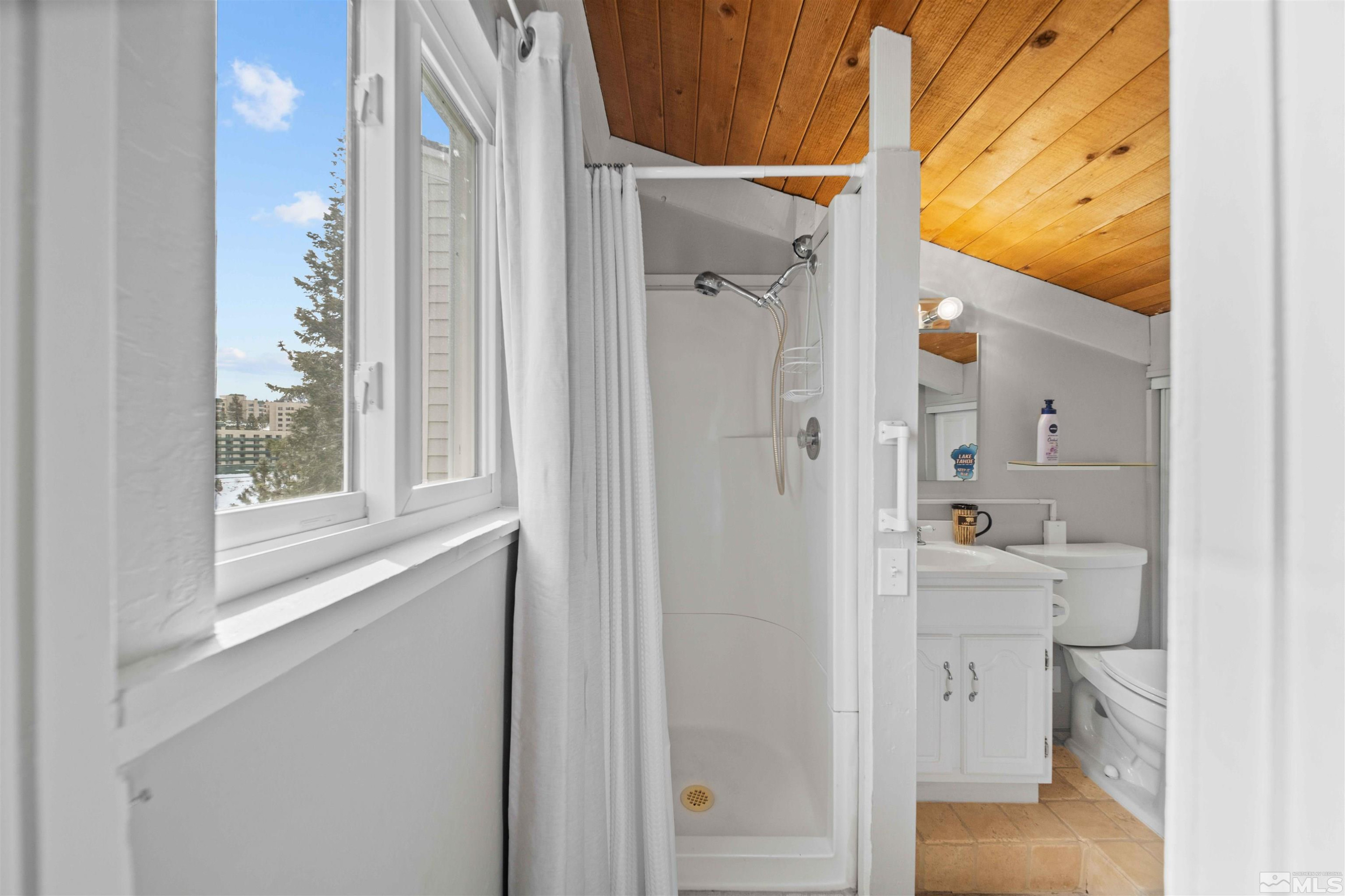 331 Tramway Drive, Unit 26 Stateline, NV 89449 - Photo 20 of 27 a bathroom with a bathtub and a shower