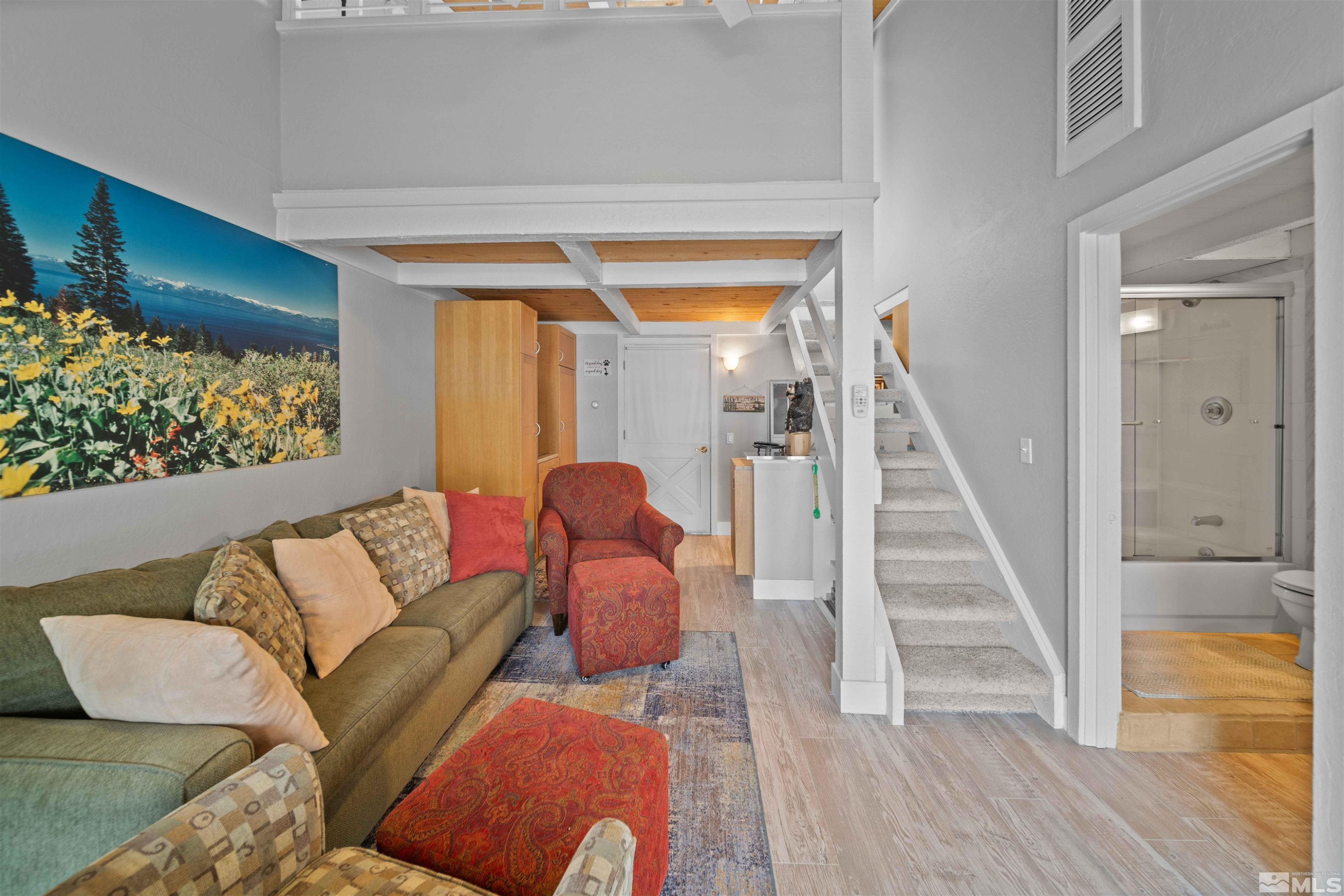 331 Tramway Drive, Unit 26 Stateline, NV 89449 - Photo 10 of 27 a living room with furniture and a wooden floor