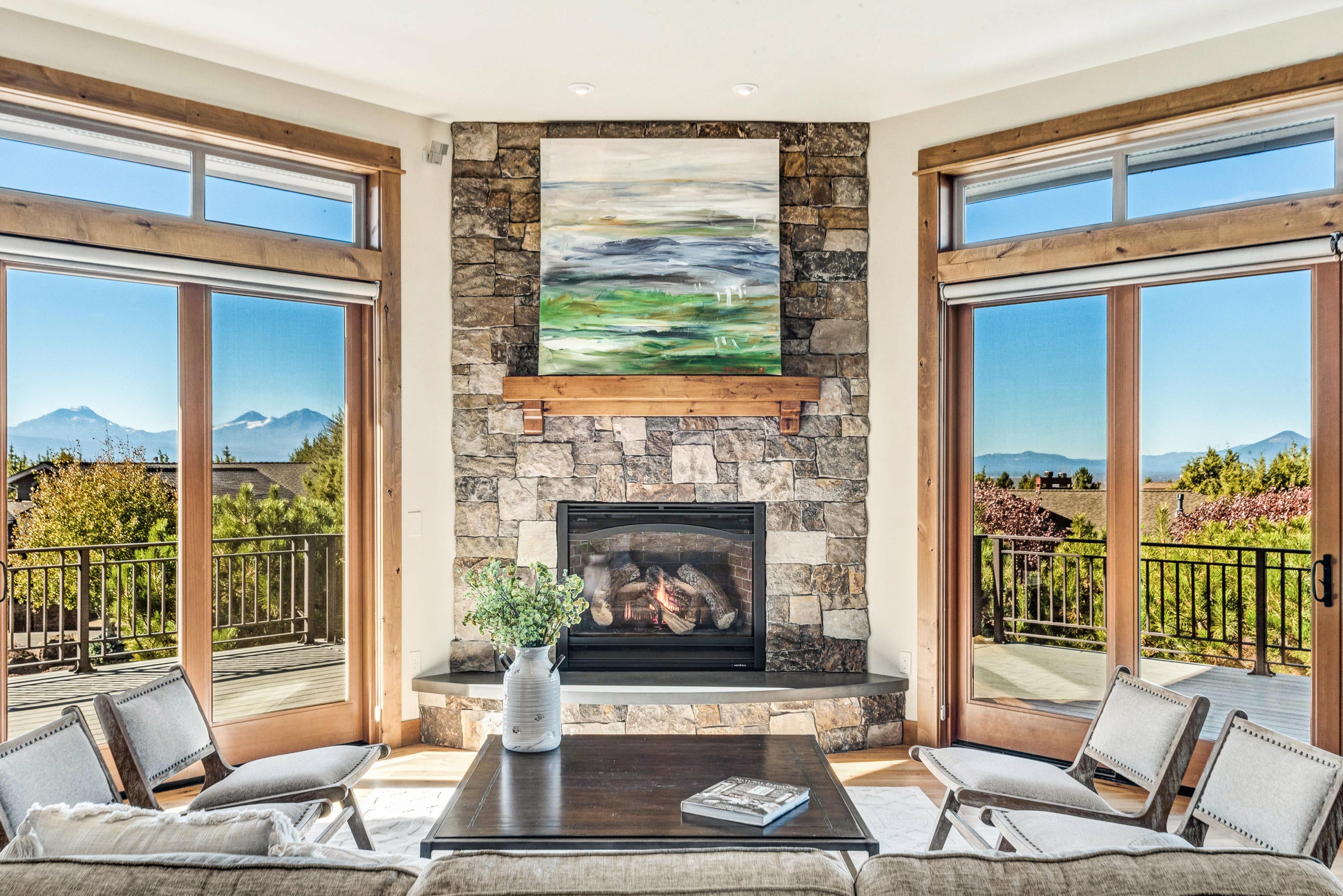 1133 Highland View Loop Redmond, OR 97756 - Photo 13 of 59 Central stacked stone fireplace with concrete hearth