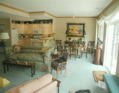 676 Main Street, Unit 676 Minturn, CO 81645 - Photo 2 of 8 a dining room with lots of furniture and chandelier