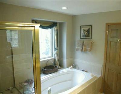 676 Main Street, Unit 676 Minturn, CO 81645 - Photo 8 of 8 a bathroom with a tub and a shower