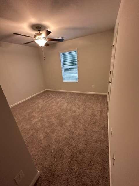 317 Lambert Overlook Circle Carrollton, GA 30117 - Photo 21 of 31 a view of an empty room with a chandelier fan