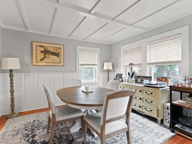 a view of a dining room with furniture and window