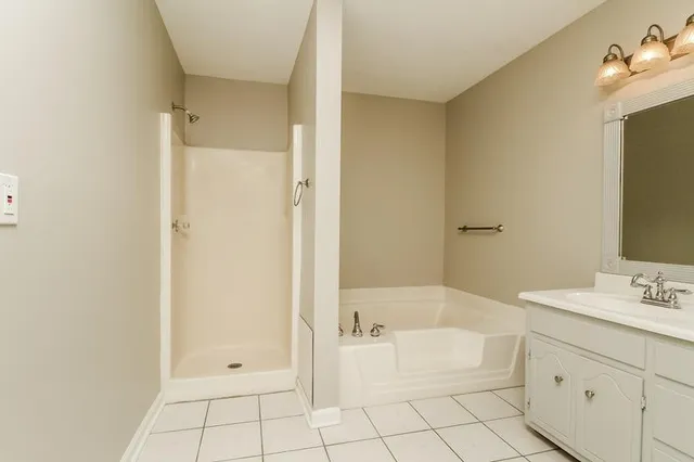 a bathroom with a bathtub and a sink