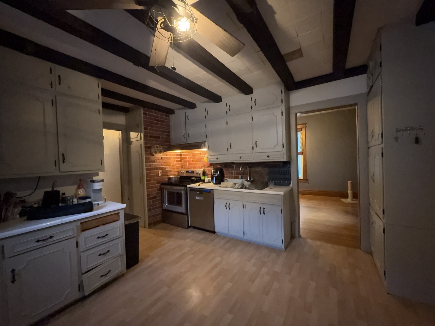 533 South 4th Street Watseka, IL 60970 - Photo 17 of 24 a kitchen with granite countertop a sink cabinets and stainless steel appliances