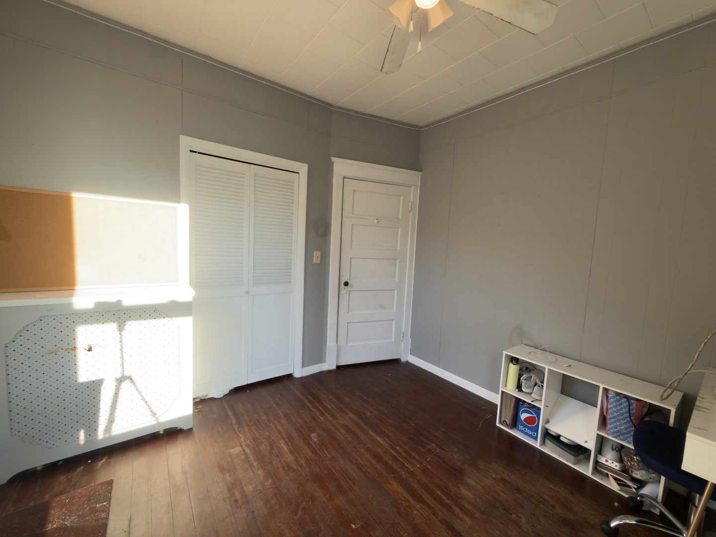 533 South 4th Street Watseka, IL 60970 - Photo 22 of 24 an empty room with wooden floor chandelier fan and windows