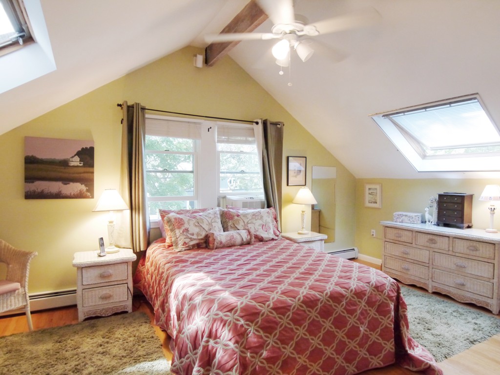 53 Overlook Road Marblehead, MA 01945 - Photo 11 of 24 a bedroom with a bed and wooden floor