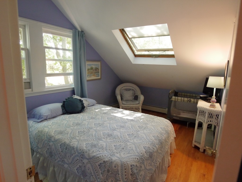 53 Overlook Road Marblehead, MA 01945 - Photo 14 of 24 a bedroom with a bed a window and chair