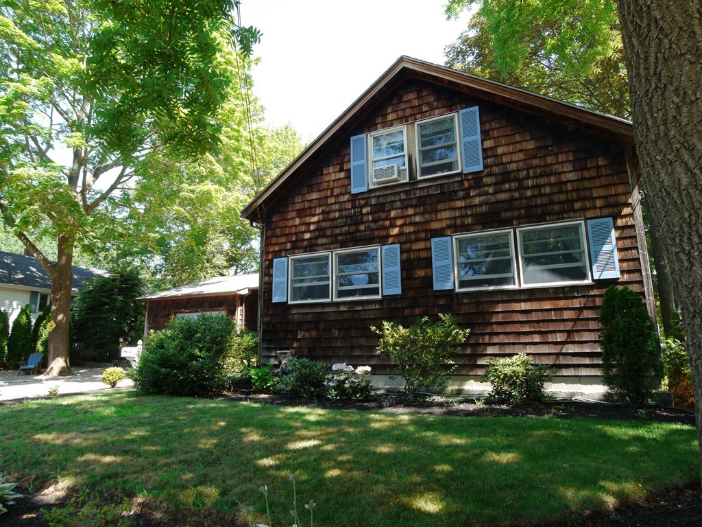 53 Overlook Road Marblehead, MA 01945 - Photo 16 of 24 a front view of a house with a garden