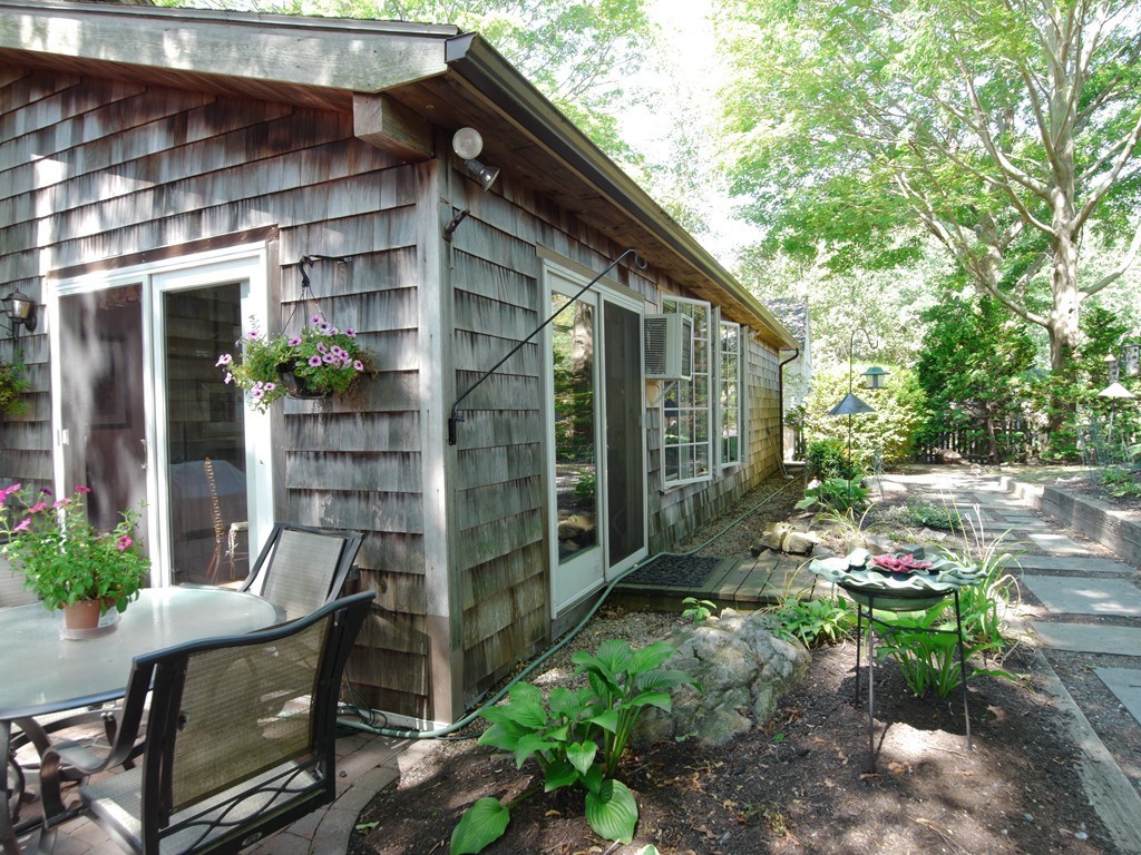 53 Overlook Road Marblehead, MA 01945 - Photo 23 of 24 a backyard of a house with outdoor seating