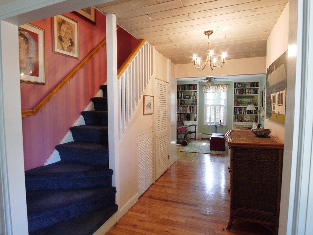 53 Overlook Road Marblehead, MA 01945 - Photo 10 of 24 a view of a livingroom with furniture stairs wooden floor and windows