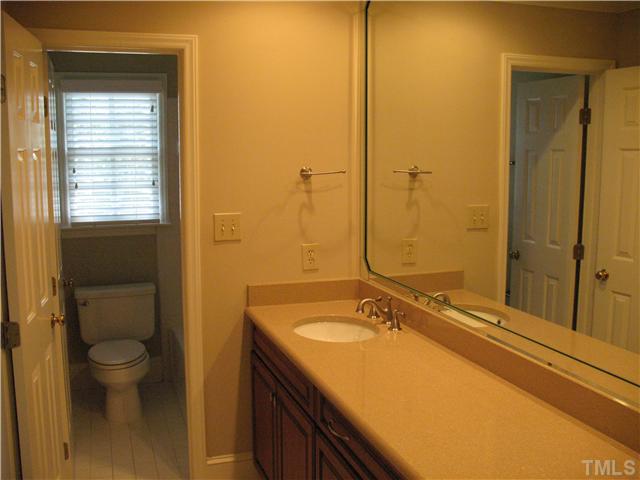 4105 John S Raboteau Wynd Raleigh, NC 27612 - Photo 16 of 20 a bathroom with a granite countertop sink toilet and shower