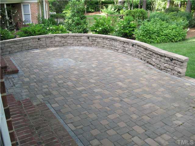 4105 John S Raboteau Wynd Raleigh, NC 27612 - Photo 19 of 20 a view of a plants with brick walls