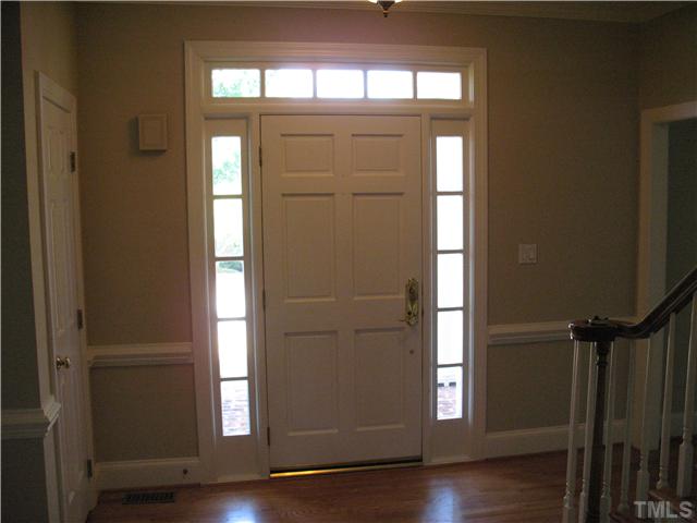4105 John S Raboteau Wynd Raleigh, NC 27612 - Photo 2 of 20 a view of a hallway with wooden floor