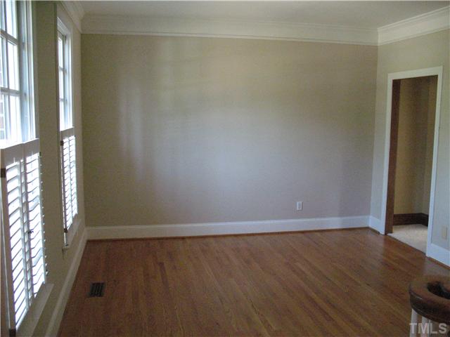 4105 John S Raboteau Wynd Raleigh, NC 27612 - Photo 3 of 20 a view of an empty room with wooden floor and a window