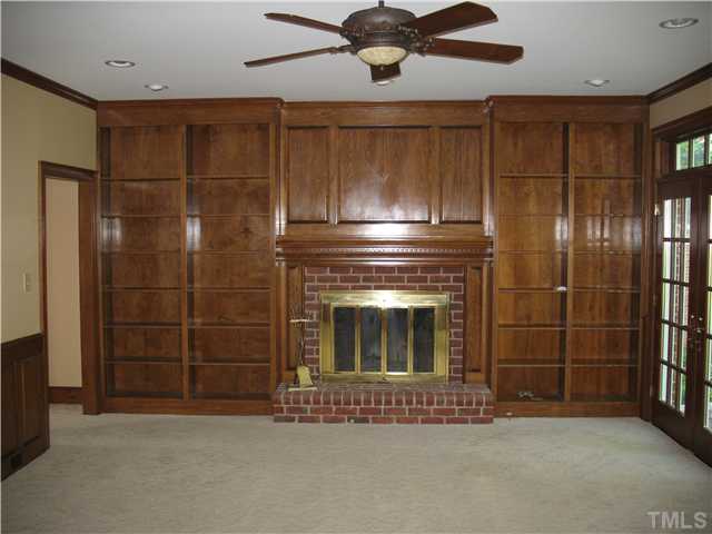 4105 John S Raboteau Wynd Raleigh, NC 27612 - Photo 5 of 20 a living room with a fireplace