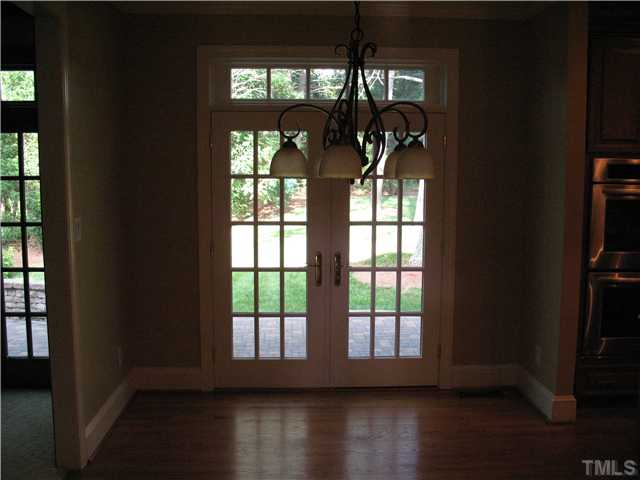 4105 John S Raboteau Wynd Raleigh, NC 27612 - Photo 8 of 20 a view of wooden floor in a hall with a window