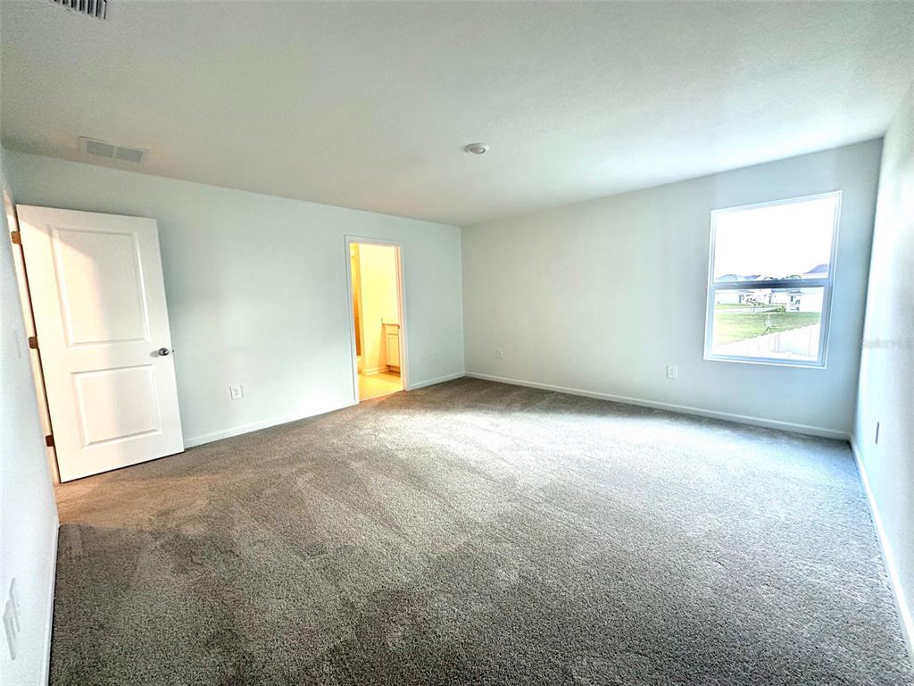 1029 Harold Pass Lake Wales, FL 33859 - Photo 13 of 24 an empty room with windows