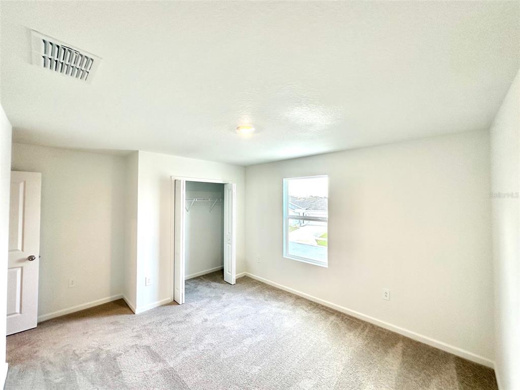 1029 Harold Pass Lake Wales, FL 33859 - Photo 20 of 24 an empty room with windows