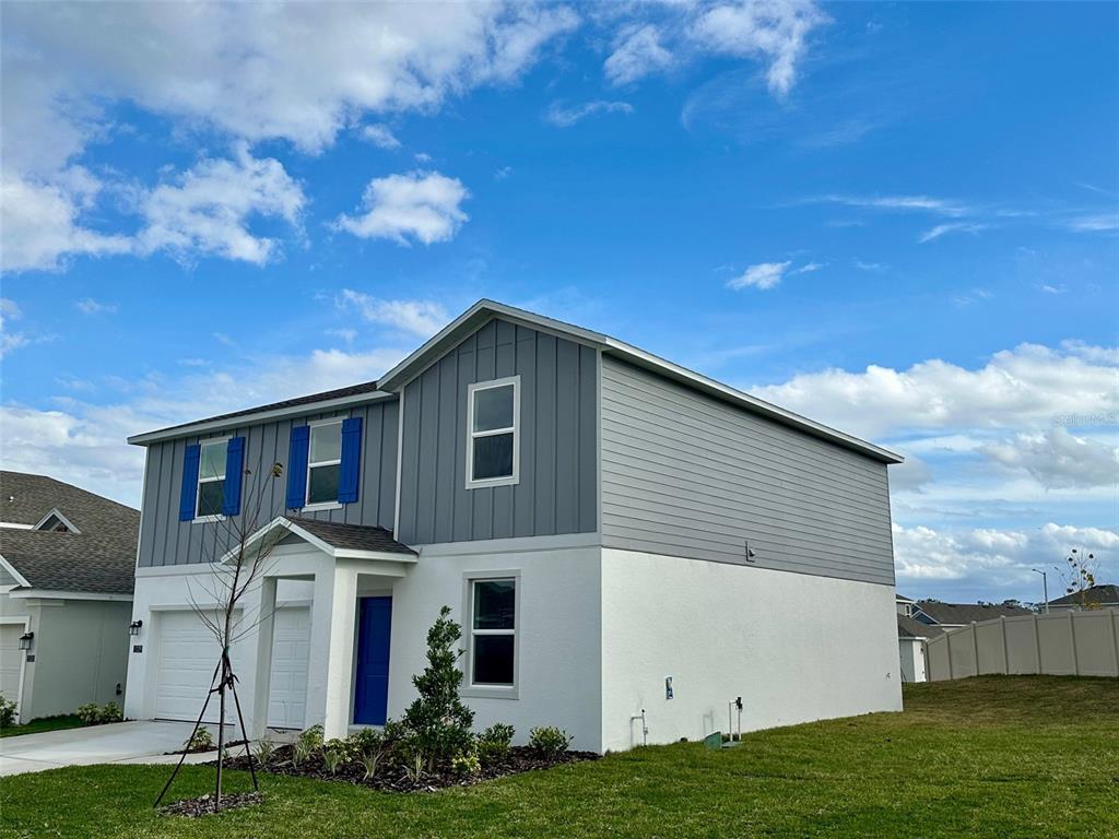 1029 Harold Pass Lake Wales, FL 33859 - Photo 2 of 24 a front view of a house with a yard