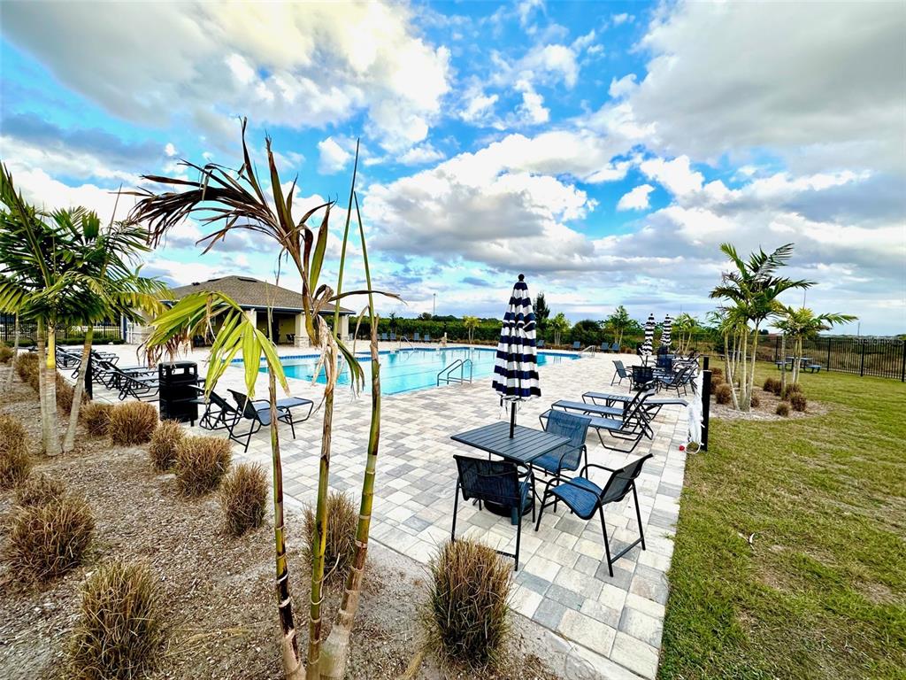 1029 Harold Pass Lake Wales, FL 33859 - Photo 24 of 24 a view of a swimming pool with a table and chairs