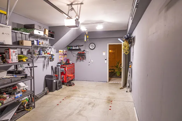 a view of a garage with rack and bicycle