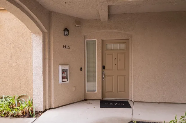 a front view of a building with garage