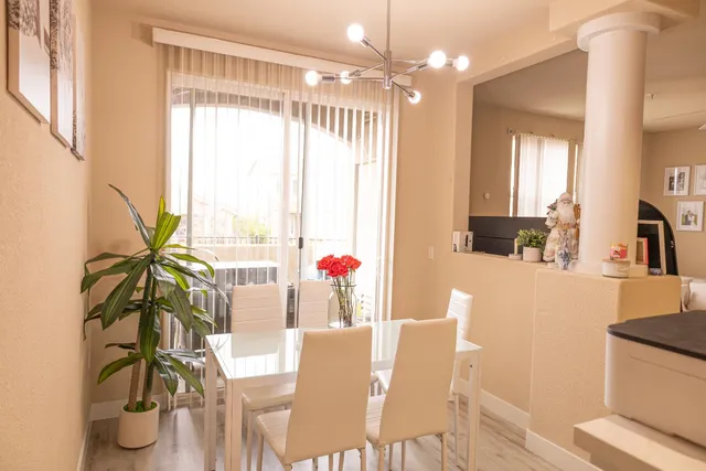 a view of a dining room with furniture window and outside view