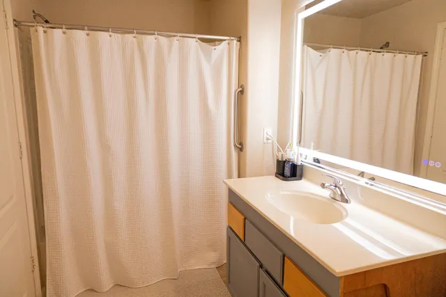 a bathroom with a sink and a mirror