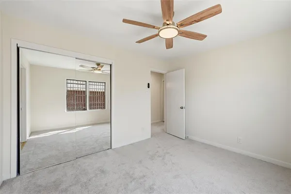 an empty room with fan